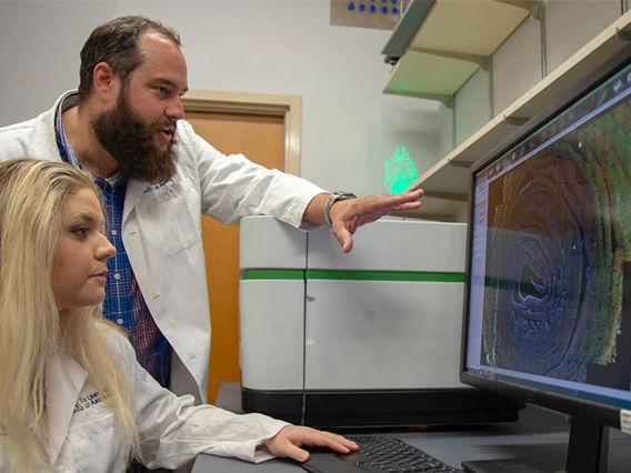 Curtis Thorne, PhD, assistant professor, cellular and molecular medicine, and one of his doctoral students, Carly R. Cabel.