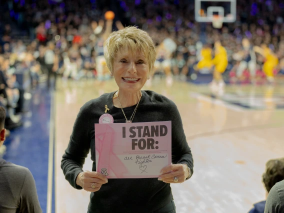 Ginny L Clements posing for a photo during basketball game