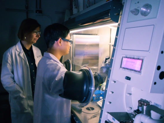 Scientists Work at a Air Filtration Hood