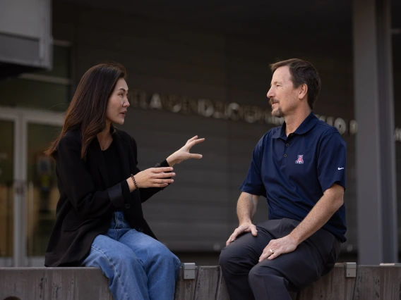 A student talks with her professor outside of the University of Arizona Mel and Enid Zuckerman College of Public Health