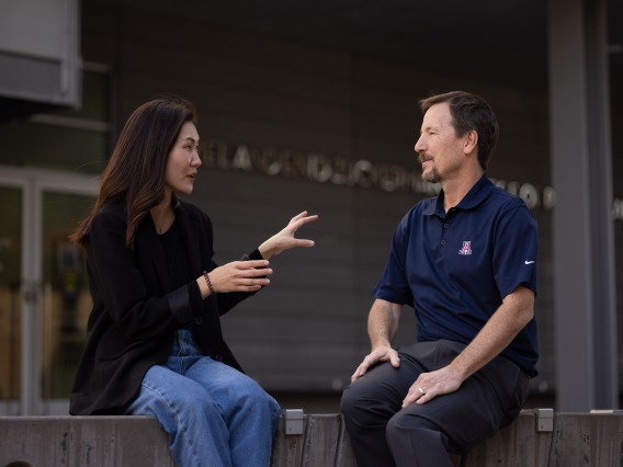 A student talks with her professor outside of the University of Arizona Mel and Enid Zuckerman College of Public Health