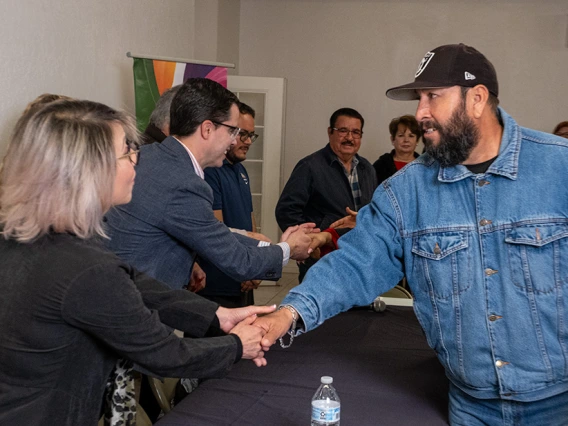 People Greeting Eachother at an Event