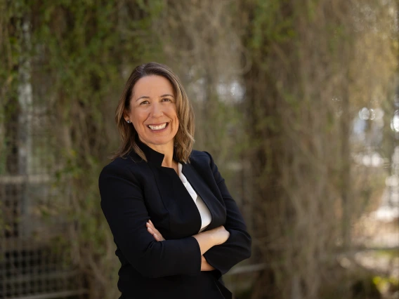 Gloria Coronado stands in front of the public health building at the University of Arizona