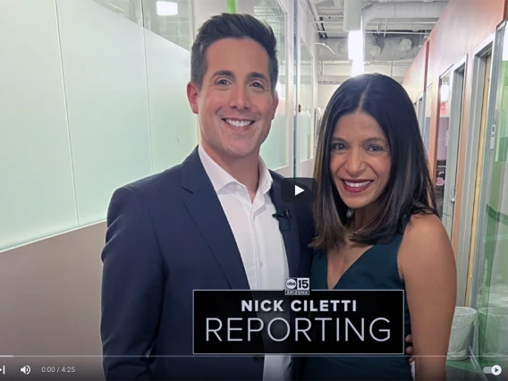 Nick Ciletti poses with Rachna Shroff in a UACC hallway.