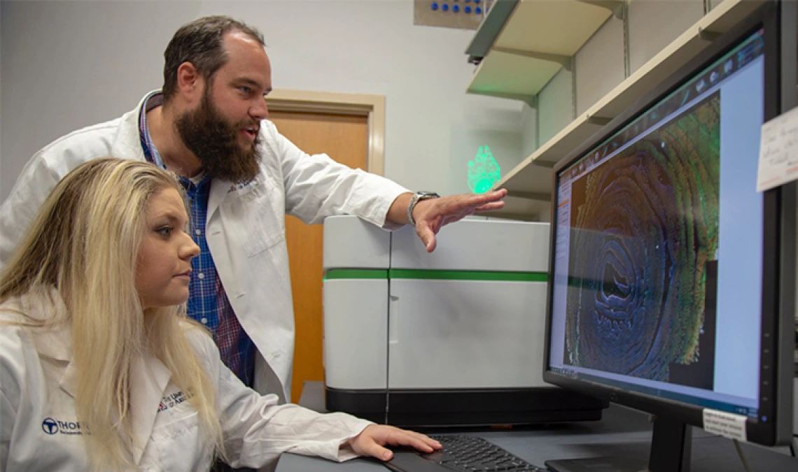 Curtis Thorne, PhD, assistant professor, cellular and molecular medicine, and one of his doctoral students, Carly R. Cabel.