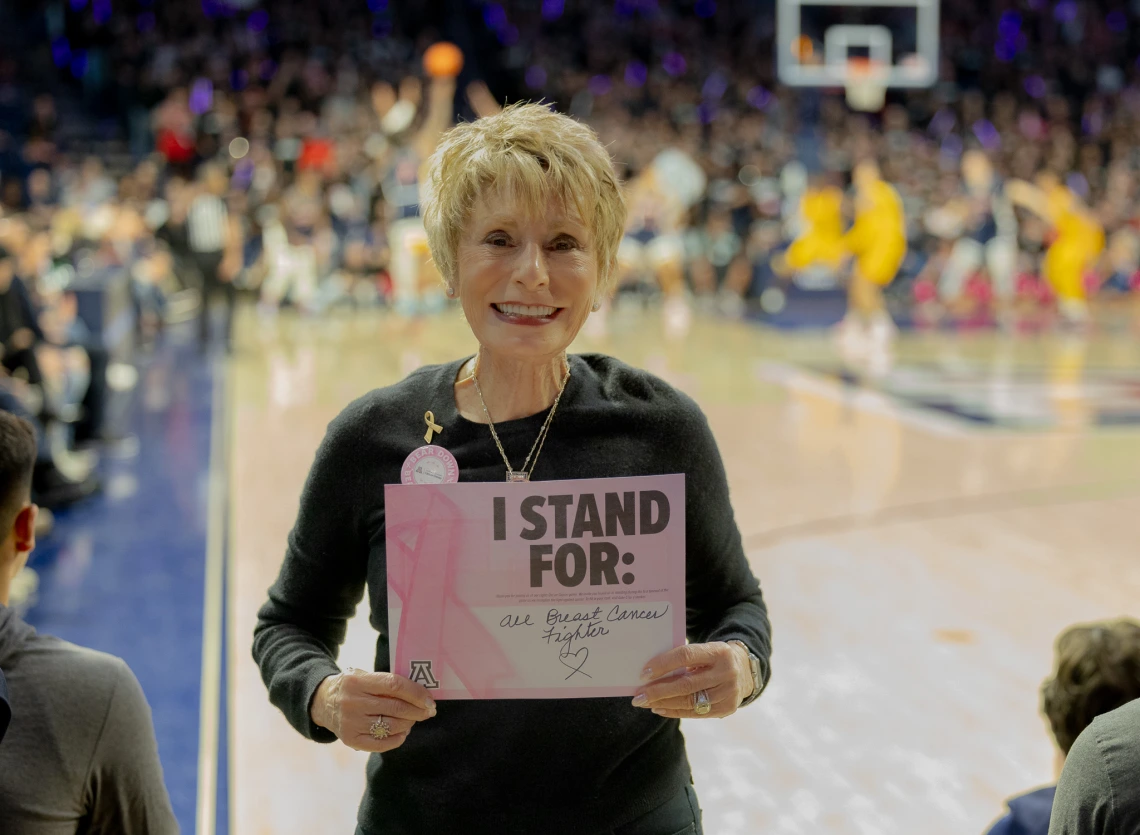 Ginny L Clements posing for a photo during basketball game