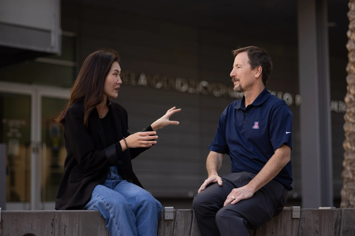 A student talks with her professor outside of the University of Arizona Mel and Enid Zuckerman College of Public Health