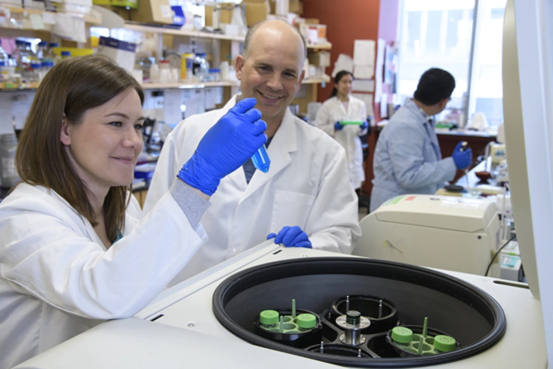 Michael Kuhns with graduate student researcher