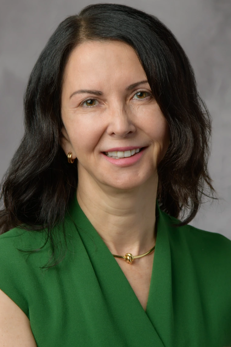 Photo of Dr. Clara Curiel-Lewandrowski smiling.