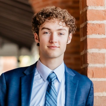 Bryce Wilson smiles in an outdoor photo.