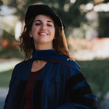 Justina Bonaventura smiles for an outdoor photo.