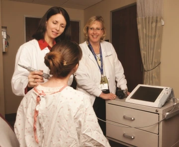Dr. Clara Curiel examines a patient.