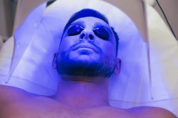Man in tanning bed.