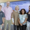 Four people pose for a photo at the sun safety community ambassador training.