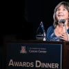 Cynthia Thomson holds her glass Lifetime Achievement Award at this year's UACC Awards Dinner.