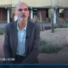 Emmanuel Katsanis is interviewed outside of the cancer center building.