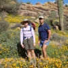 Karen Hastings and her husband walk along a mountain trail on a sunny day in Tucson.