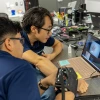 DK Kang in his laboratory working with a graduate student