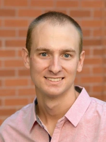 Portrait of Dylan Miller, PhD.